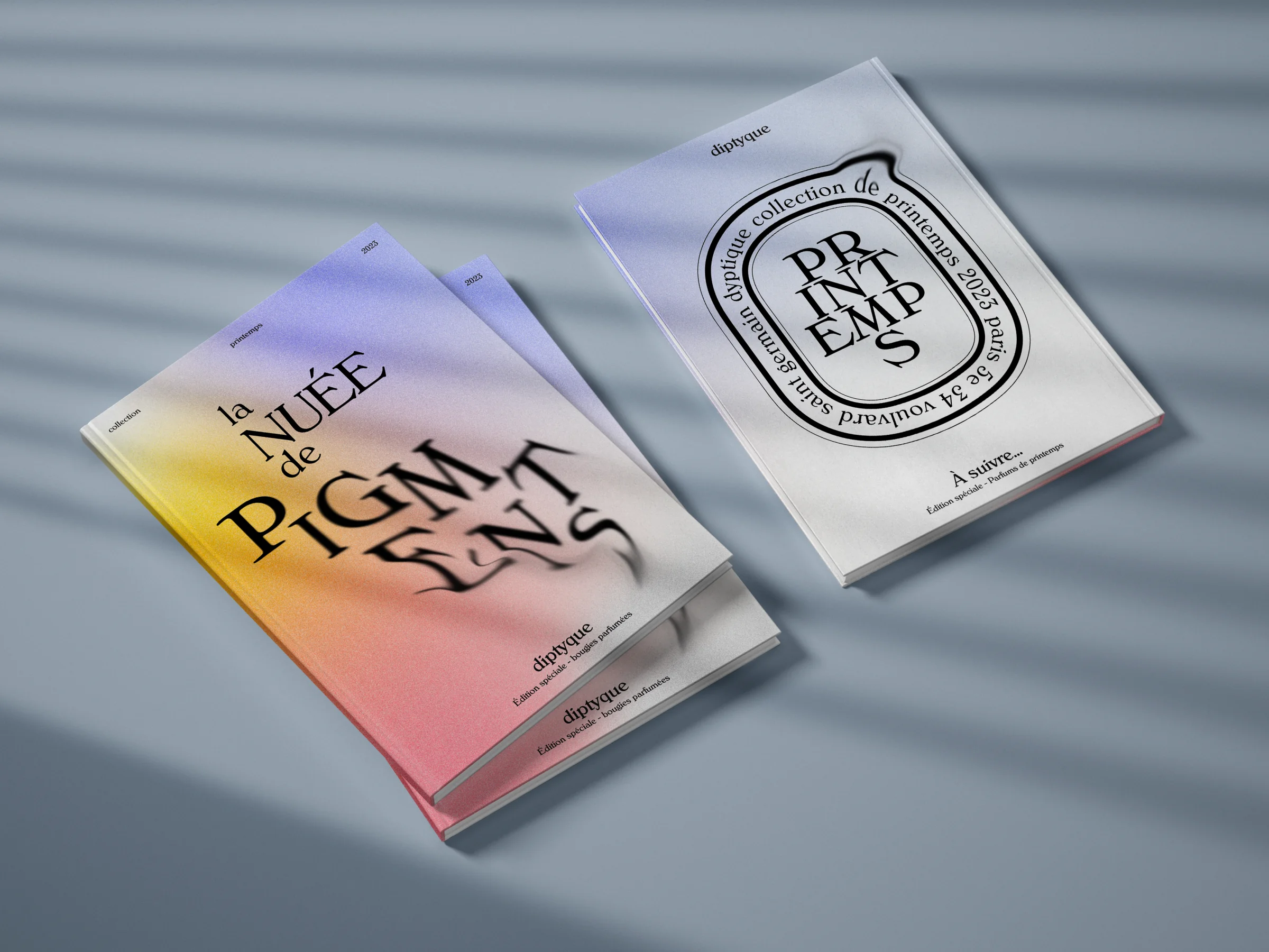 Diptyque, deux magazines posés en mise en scène : couverture nuée de pigments dégradée, couverture printemps Diptyque.