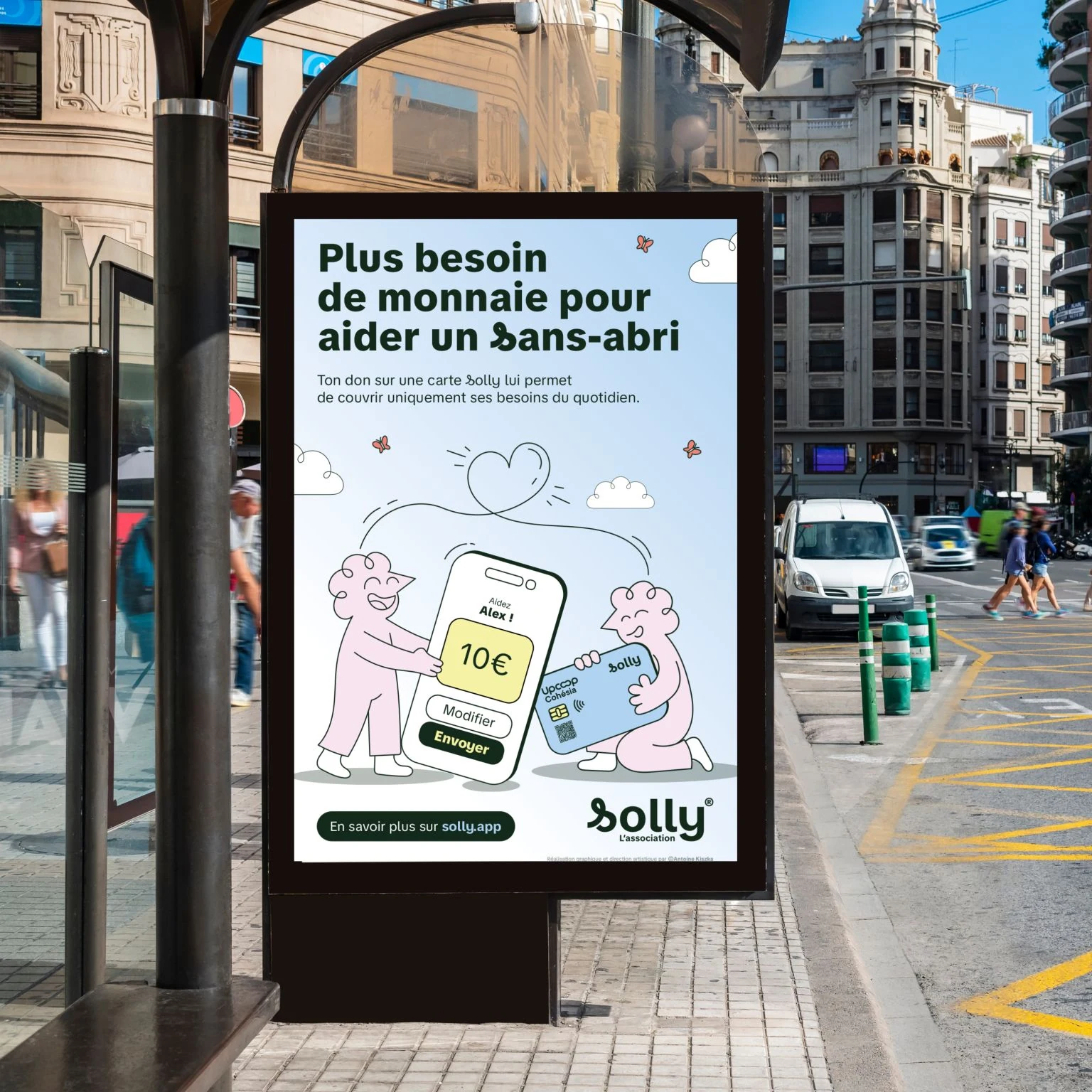 Affichage abribus Solly à Valence : Plus besoin de monnaie pour aider un Sans-abri, illustration de don avec le téléphone et la carte.